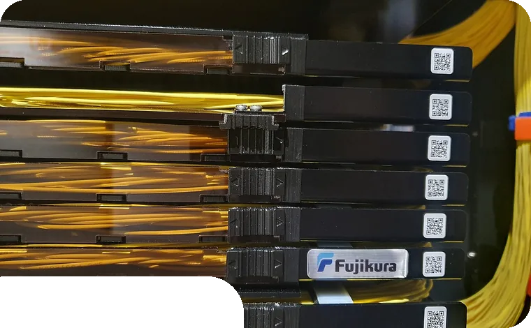 Glowing fiber-optic modules in a rack