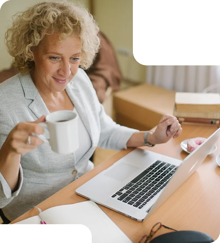 Working on a laptop over coffee