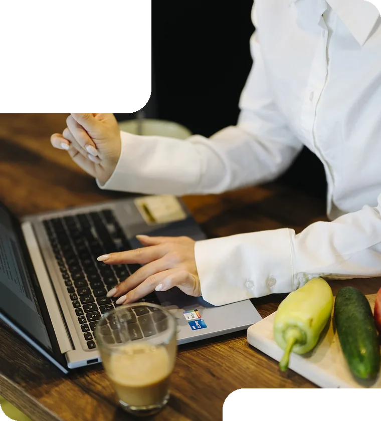 Typing on a laptop